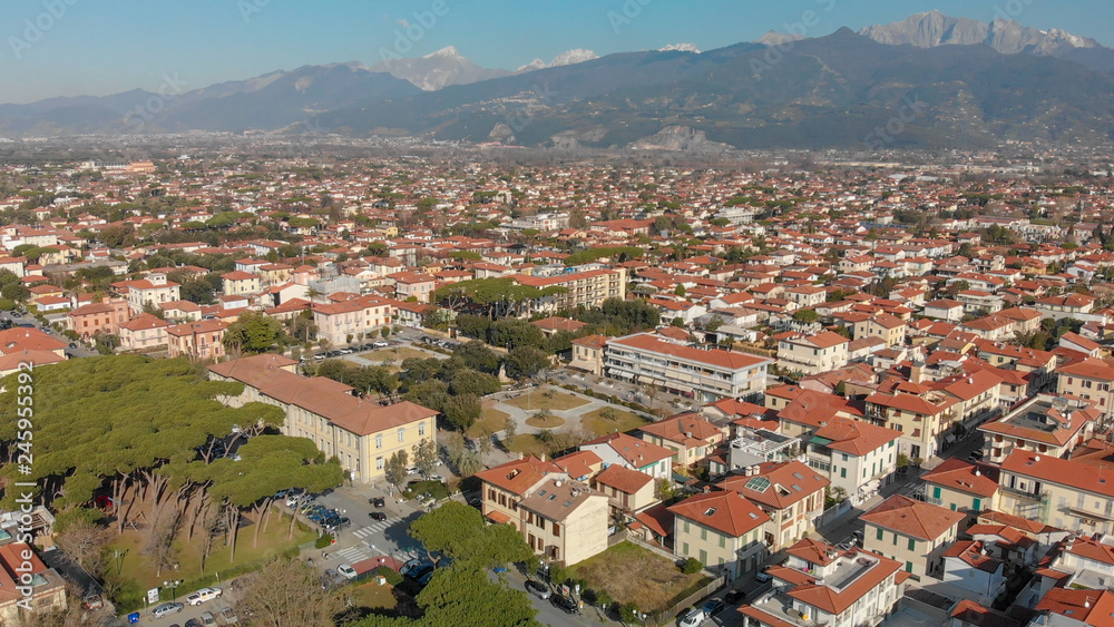 Aerial panoramic view of Forte dei Marmi skyline on a sunny winter morning, drone perspective