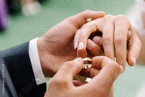 groom holds the hand of the bride at the wedding ceremony. close-up