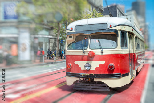 Famous red streetcar tram speeding up in Market Street, San Francisco, CA