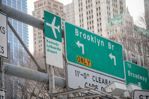 Photography Brooklyn Bridge and Airports street signs in New York City