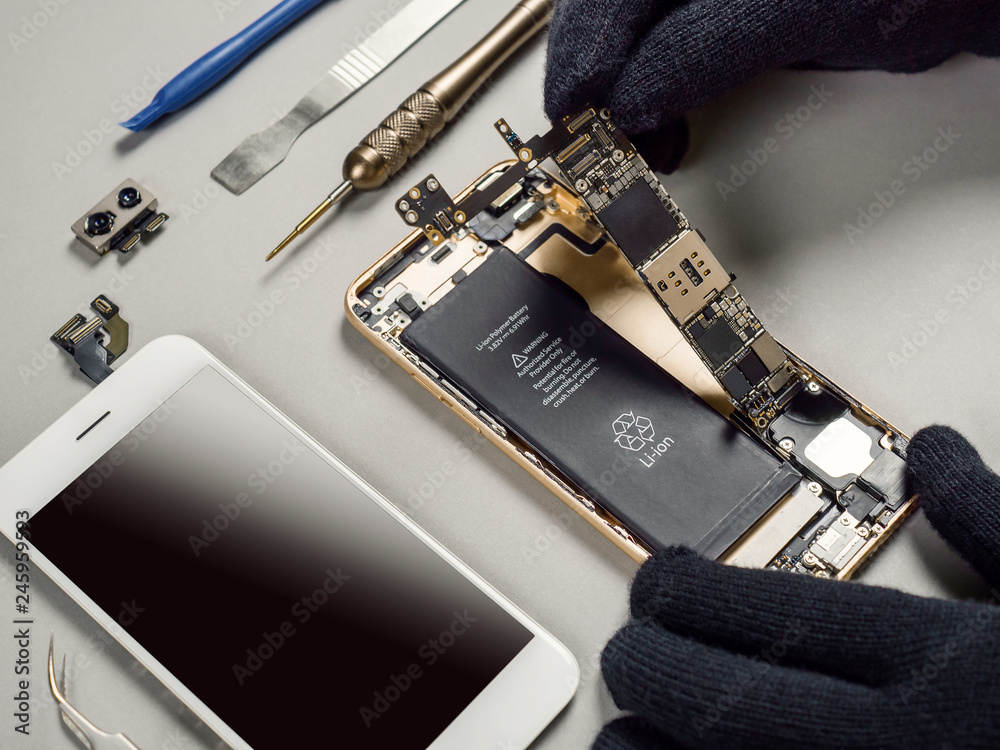 Konstfotografi Technician or engineer disassembling components broken smartphone and take off l