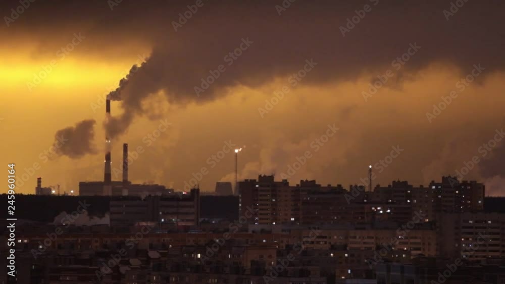 Industrial concept. Rows of buildings. Industrial pipes exhales the smoke Industrial concept. Rows of buildings. Industrial pipes exhales the smoke