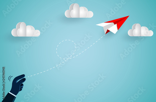 hand human who threw the red paper plane up to the sky while flying above a cloud. creative idea. illustration cartoon vector