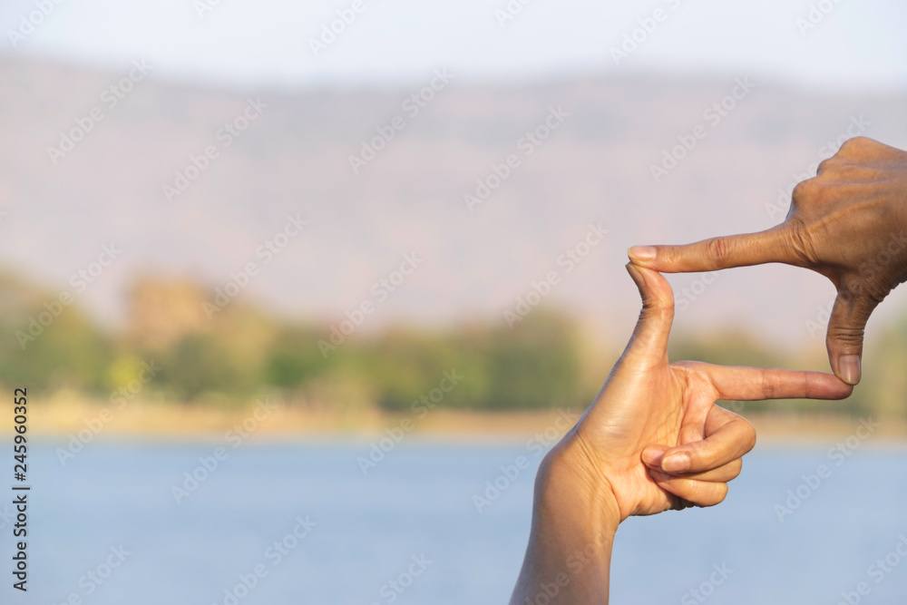 Hands of person making frame distance or symbol in nature. Hands of person making frame distance or symbol in nature.