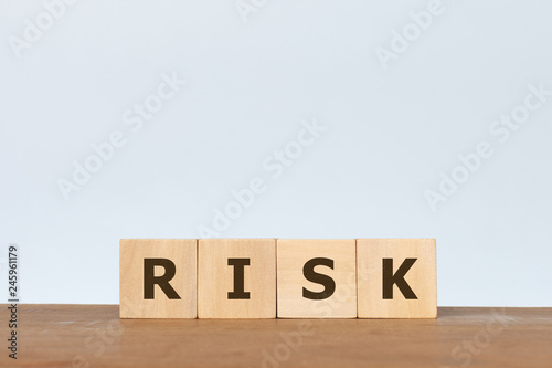 Fototapeta Naklejka Na Ścianę i Meble -  Wooden cube with the word RISK on white background. Investement Risk management concept