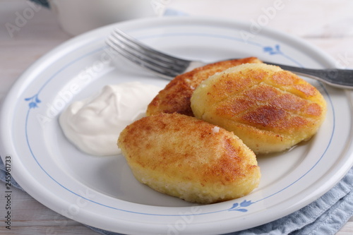 Potato meat filling patties with sour cream