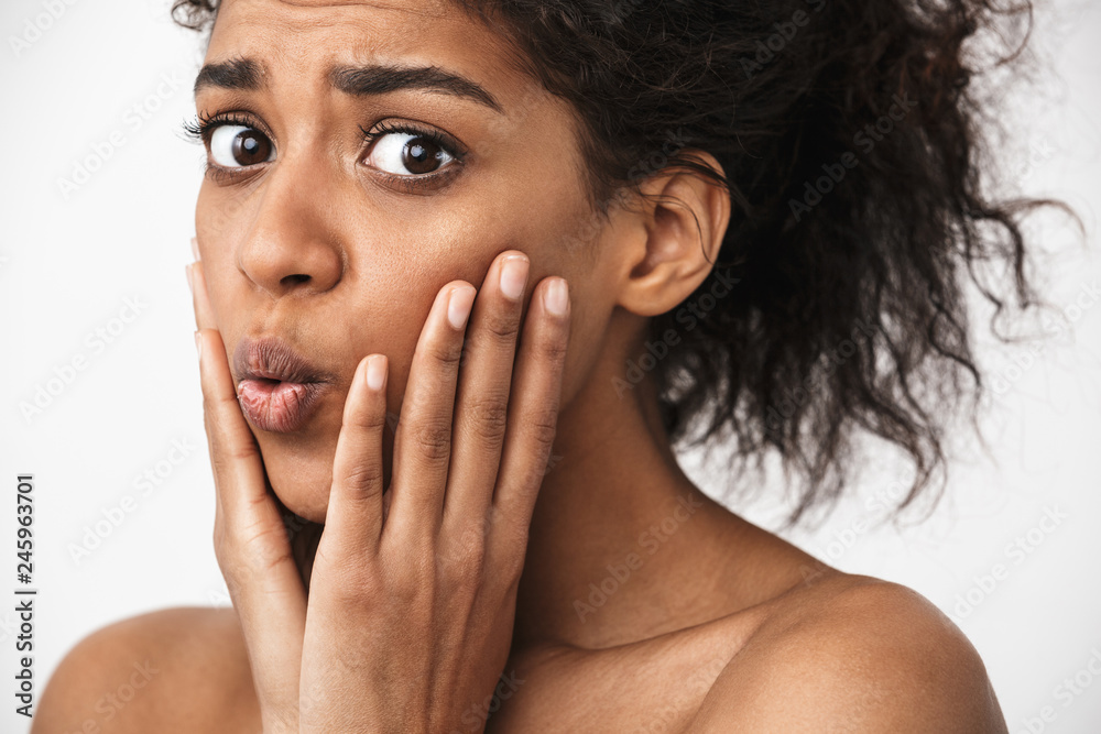 Close up of a beautiful shocked young topless african woman Close up of a beautiful shocked young topless african woman