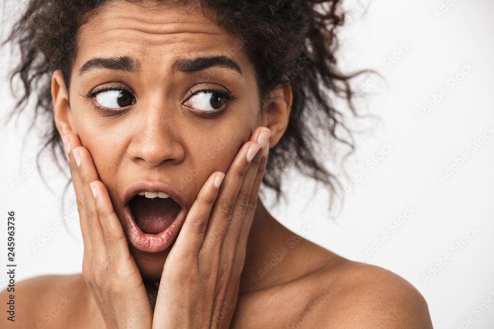 Close up of a beautiful shocked young topless african woman Close up of a beautiful shocked young topless african woman