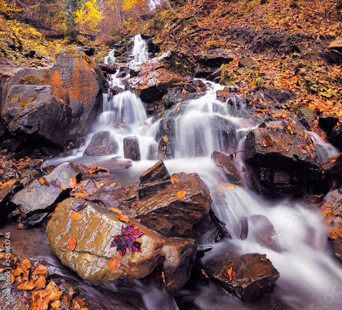 waterfall at the autumn forest