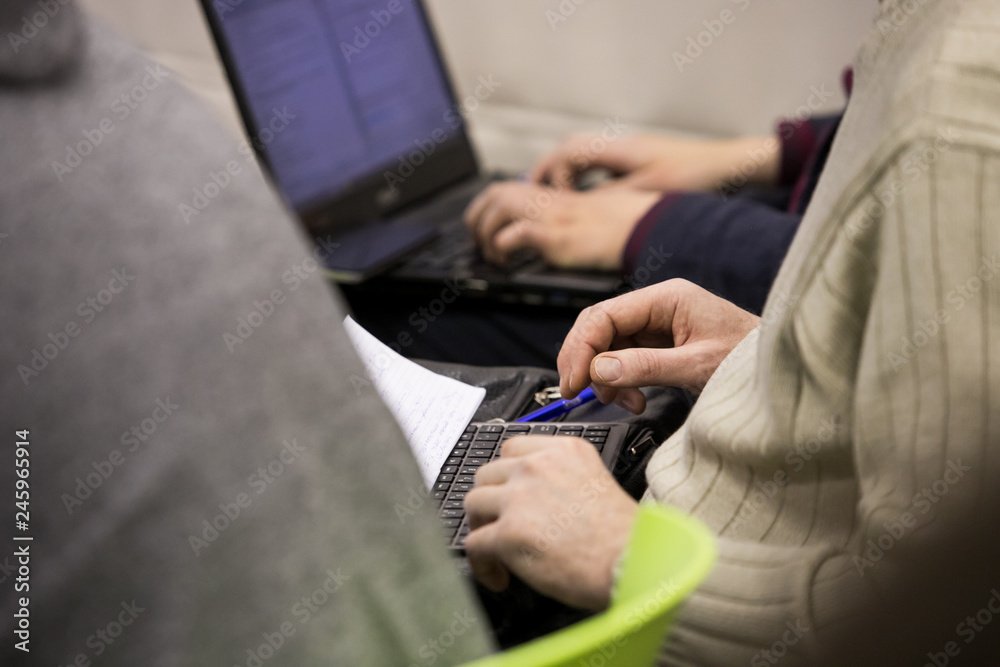 business people hands typing on smart phone during the seminar at conference room business people hands typing on smart phone during the seminar at conference room