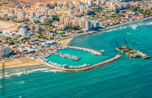 Sea port city of Larnaca, Cyprus.  View from the aircraft to the coastline, beaches, seaport and the architecture of the city of  Larnaca. photo