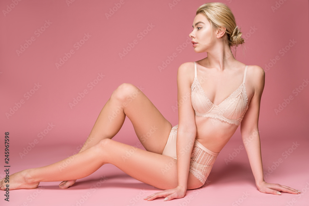 beautiful girl posing in lingerie, isolated on pink beautiful girl posing in lingerie, isolated on pink