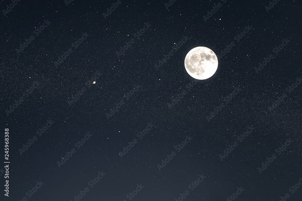 Huge full moon on the night sky with bright stars Huge full moon on the night sky with bright stars