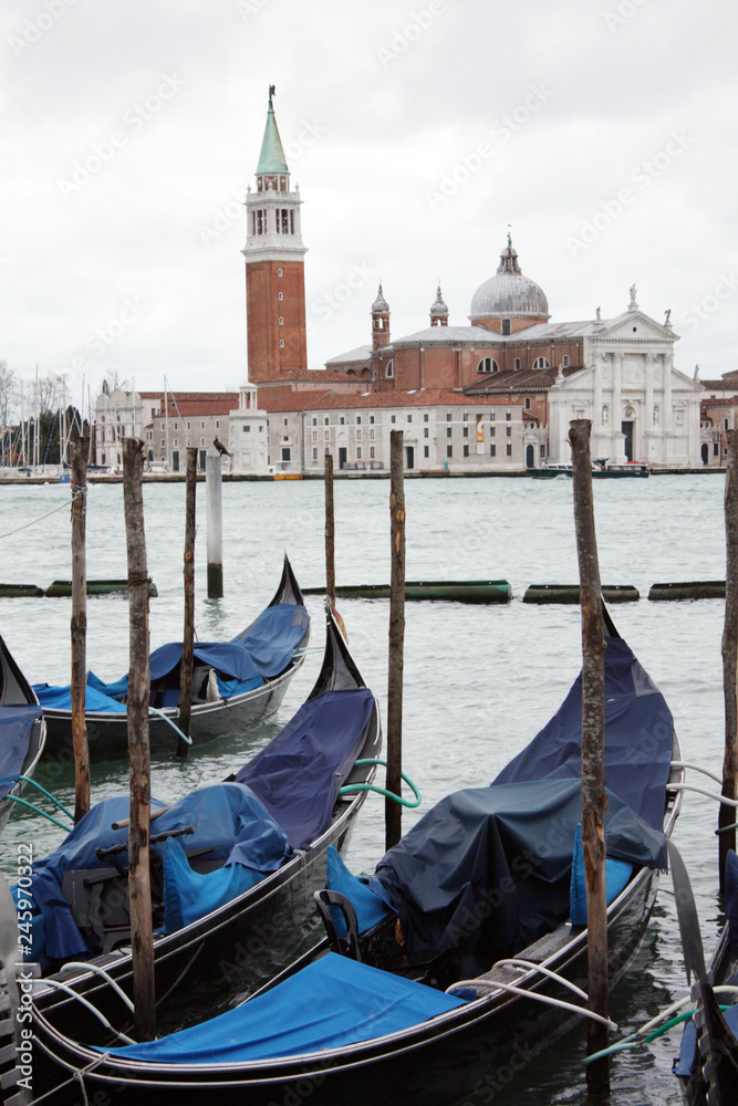 Gondolas in Venice Italy Adriatic sea. Markusdom. St Mark's Basilica Square. Saint Marco Square.	