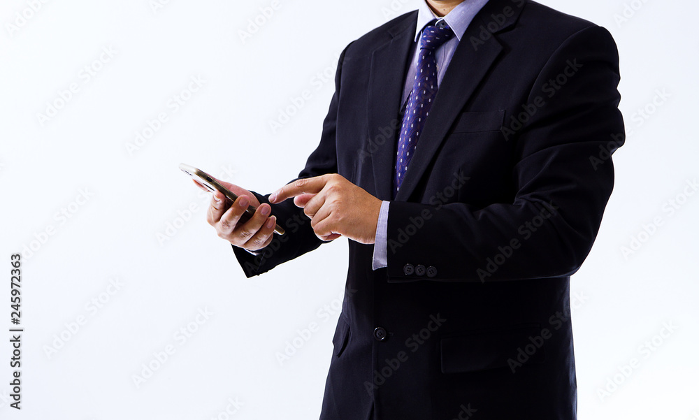 midsection businessman holding mobile phone against white background midsection businessman holding mobile phone against white background