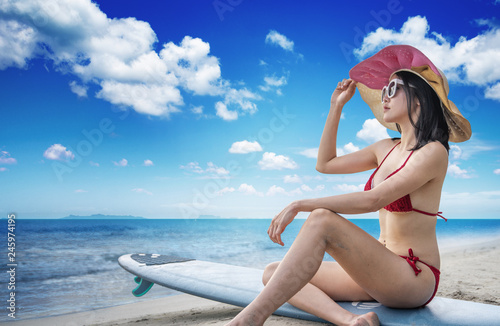 Young women in bikini relax on beach, Vacation concept..