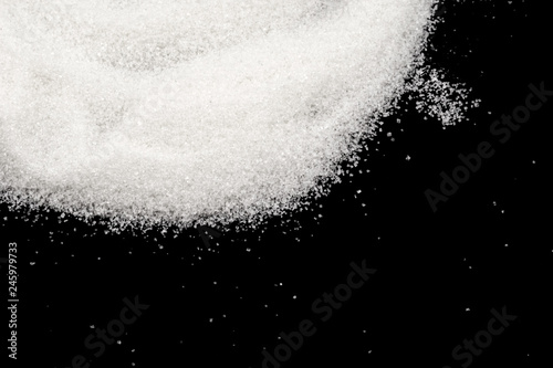 Scattered sugar on a black background