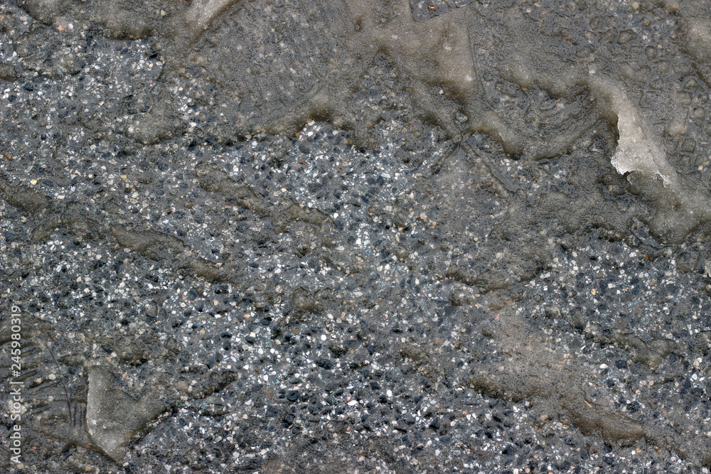Melting snow asphalt slush water flow puddle dirty street sidewalk Melting snow asphalt slush water flow puddle dirty street sidewalk