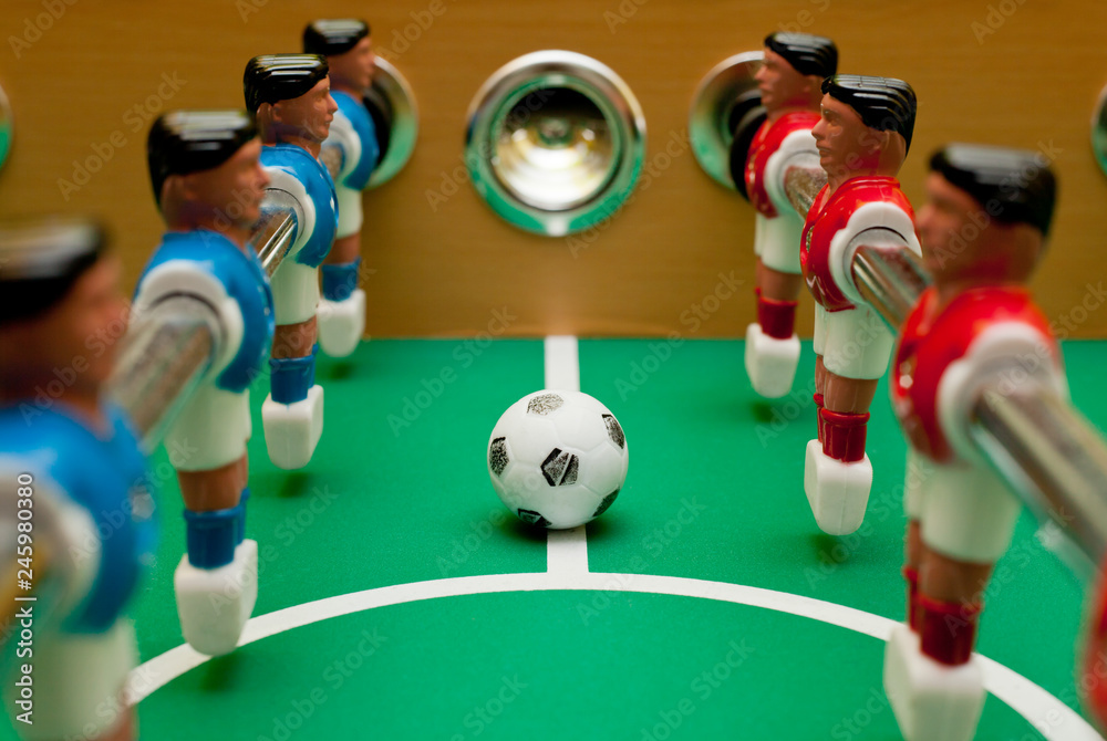 Fototapeta premium Table football players, close-up with the ball.