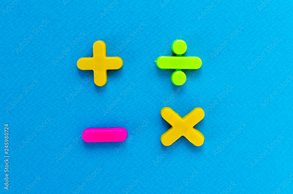 Obraz premium plus, minus, divide, multiply on blue background