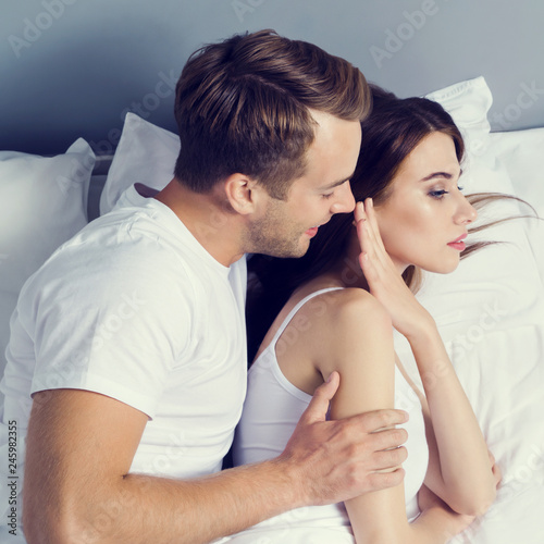 Unhappy young couple on the bed