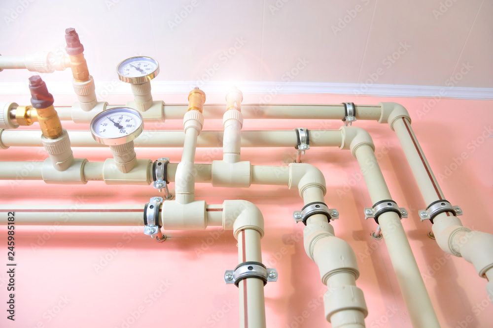 Plumbing communications background. Water heater system with pipes and taps.