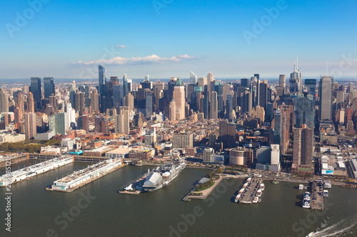 New York  Midtown  Manhattan in  NYC NY in USA.  Aerial helicopter view. Pier 84 at Hudson River Park and circle line Sightseeing Cruises © ozerkina