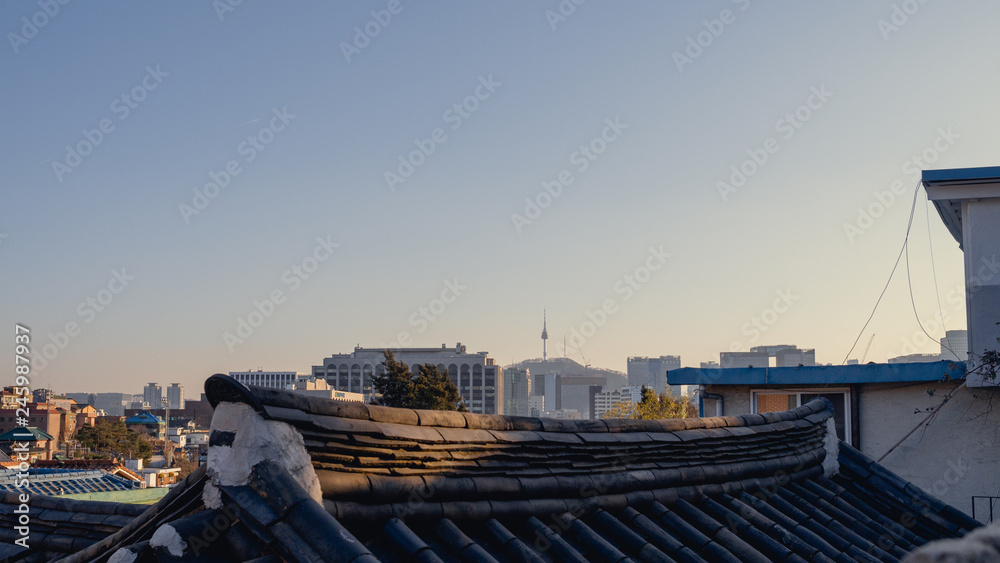 Old traditional roof and New cutting edge skyline Old traditional roof and New cutting edge skyline