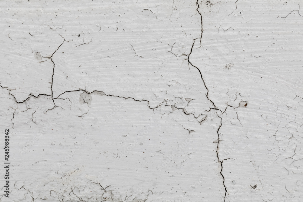 Fototapeta premium Granzhevy texture for a background. The old cracked concrete wall of light-gray color