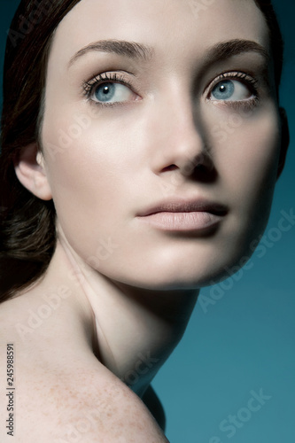 Close up of young woman with blue eyes