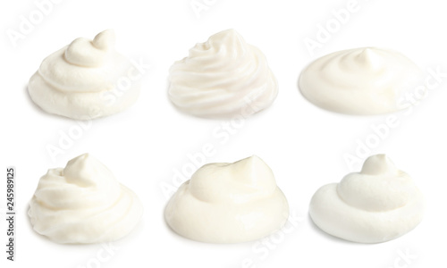 Set of delicious sour cream on white background