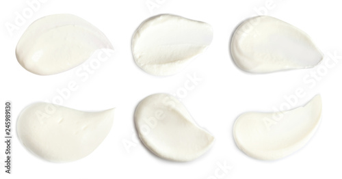 Set of delicious sour cream on white background, top view photo