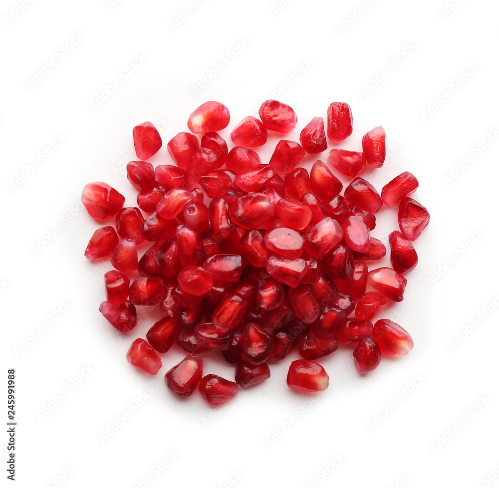 Pomegranate seeds on white background, top view. Delicious fruit