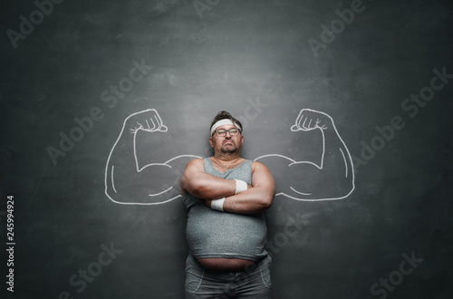 Funny sports nerd with huge muscle arms drawn on the gray background with copy space