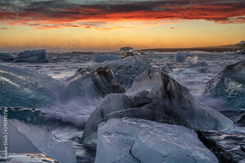 Ice floes on raging heavy sea at the shore of North Atlantic Ocean at the famous glacier lagoon in Vatnajokull National Park, Iceland