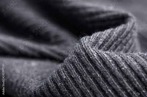 Fabric warm black gray sweater textile material texture blur background macro