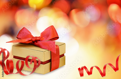 Gift box with red ribbon bo...