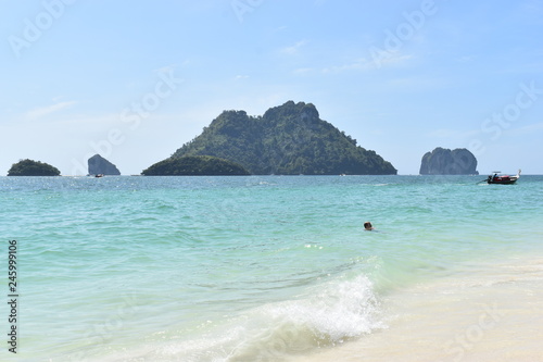 Beautiful lonely beach with a big mountain in background at Poda Island in Krabi, Thailand, Asia