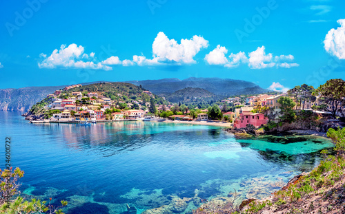 Fototapeta Naklejka Na Ścianę i Meble -  Beautiful landscape with bay and colorful buildings on the background of picturesque clouds in the town of Asos, Greece, Kefalonia. Wonderful exciting places.