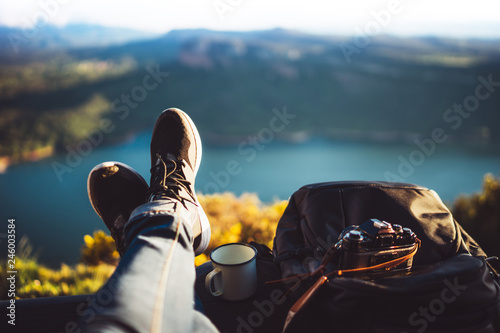 view trekking feet tourist backpack photo camera in auto on background panoramic landscape mountain, vacation concept, foot photograph hiking relax in auto, photographer enjoy trip holiday, mockup photo
