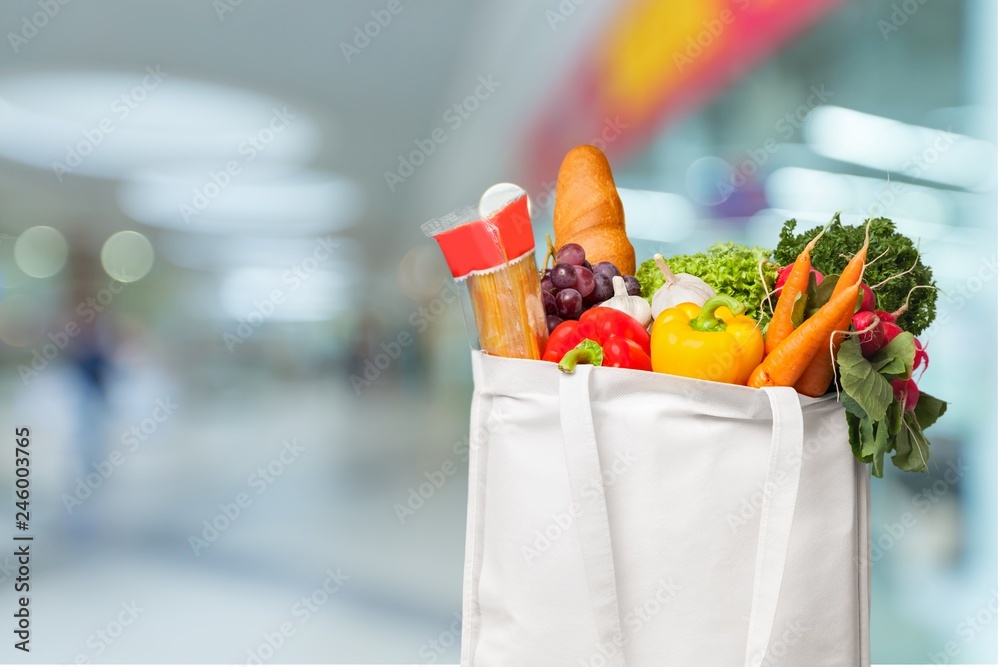 Full shopping bag, isolated over background Full shopping bag, isolated over background