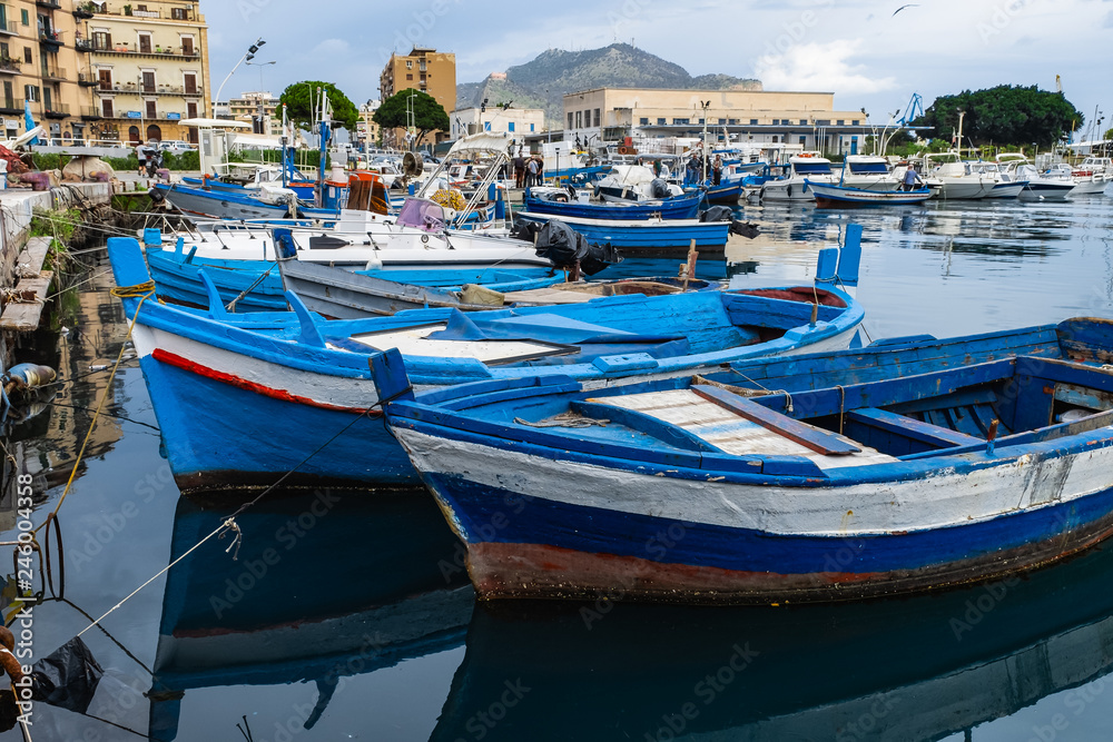 Fishing wooden boats in the harbor of Palermo