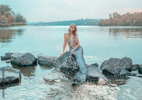 Fotografiet fair-haired mermaid in love dreams of handsome prince, new story Ariel, image of