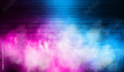 Background of empty wooden wall and concrete floor. Spotlight light, blue and pink neon light, smoke