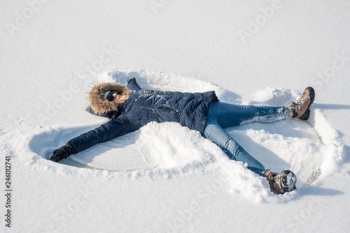 making snow angels in fresh snow photo