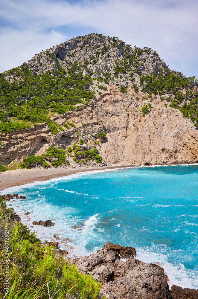 Scenic mountainous landscape with Coll Baix beach on Mallorca, Spain.