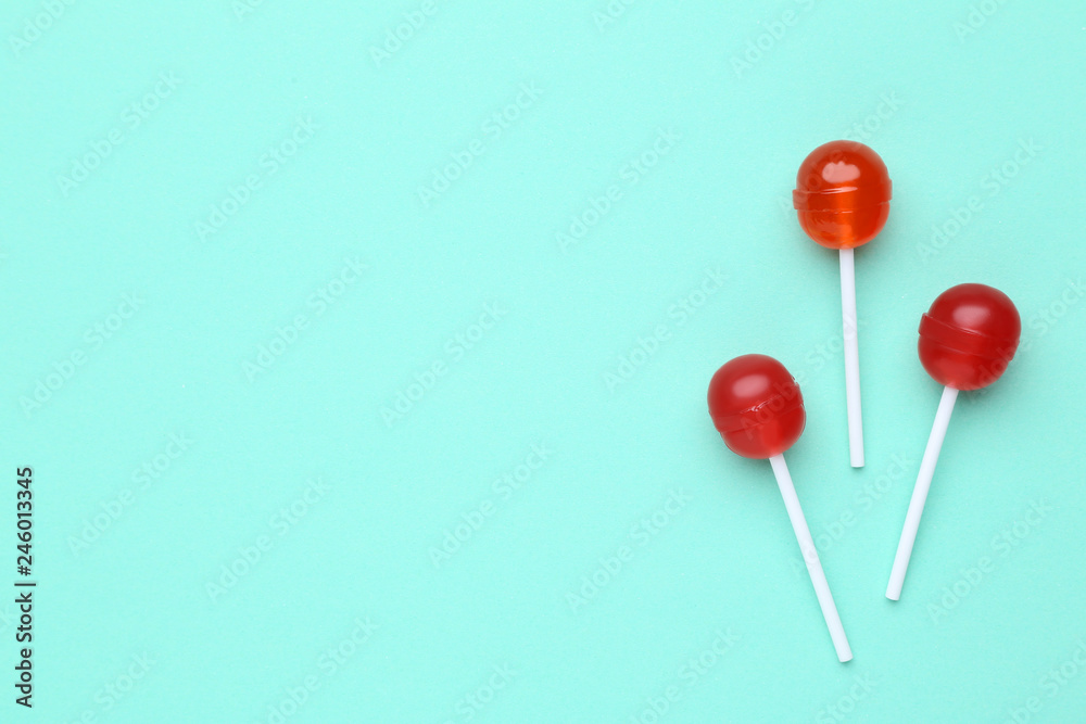 Sweet lollipops on mint background Sweet lollipops on mint background