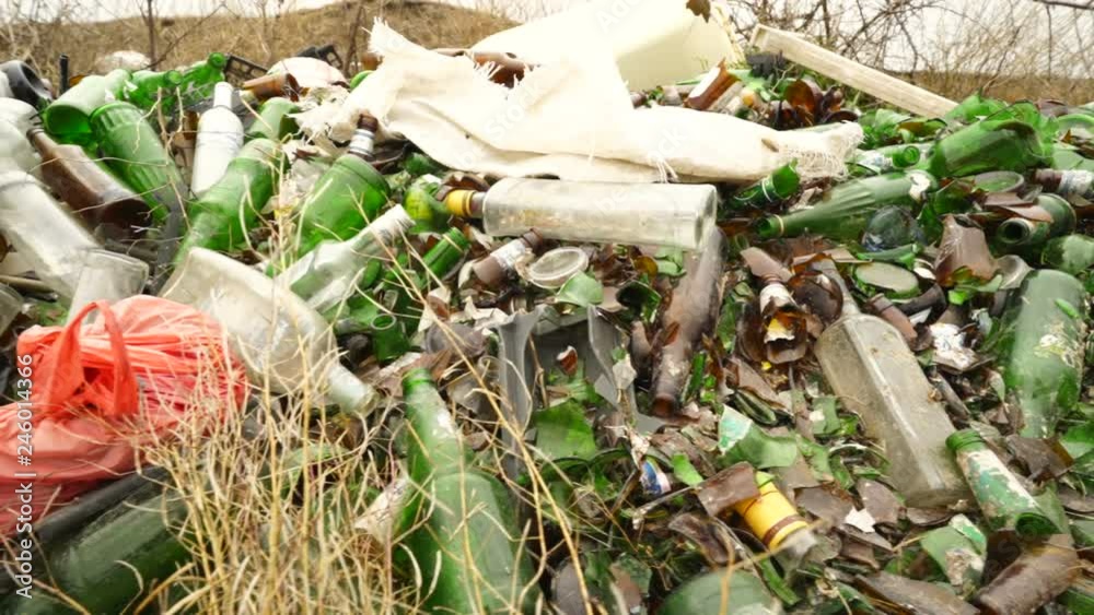 Illegal dumping site with household garbage. Rubbish dumped illegally