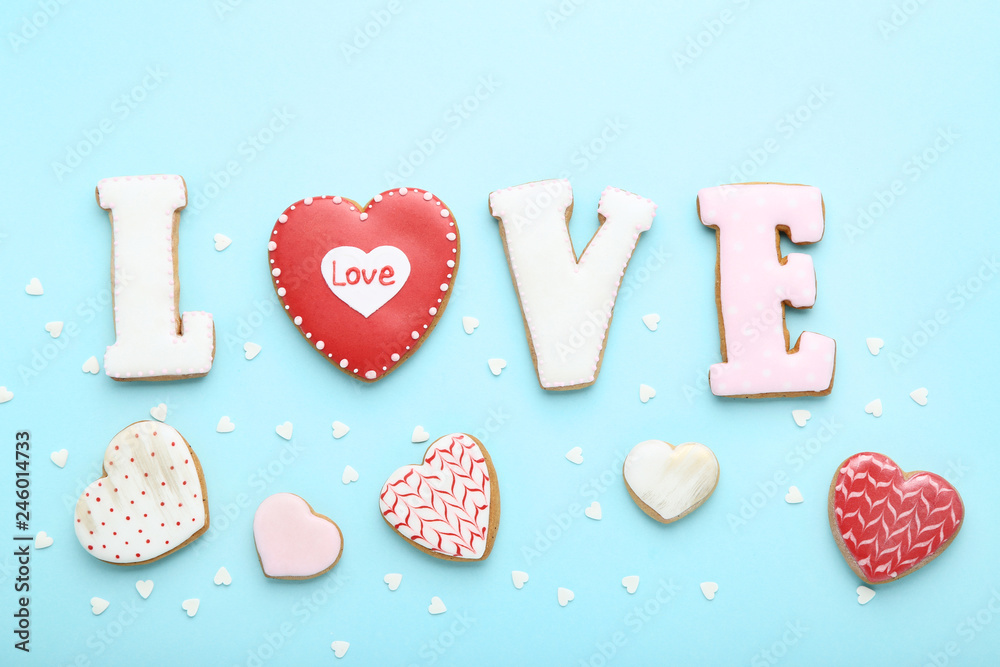 Fototapeta premium Valentine day cookies and word Love on blue background