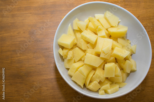Bowl with pieces of potato.